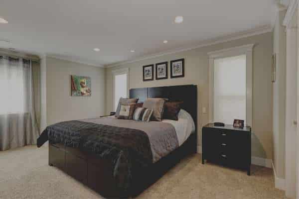 Add Wood Texture And Personal Memorabilia For A Black And Grey Bedroom